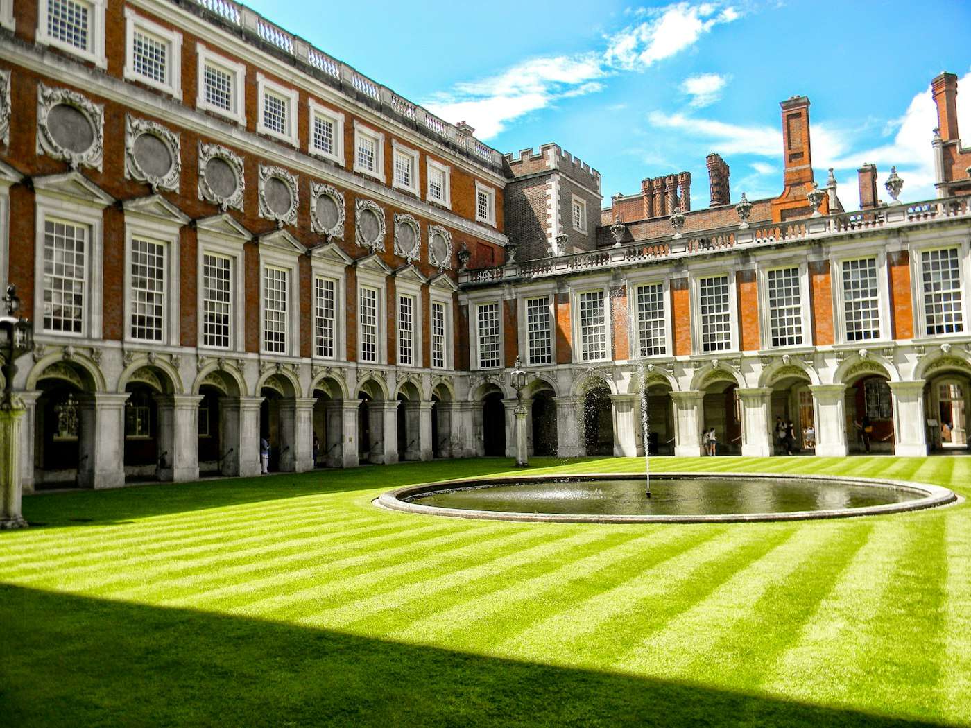 Fountain Court's arcades and striped lawn at Hampton Court Palace